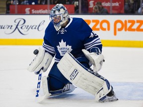 Toronto Maple Leafs' goaltender Jonathan Bernier makes a save against the Pittsburgh Penguins during third period NHL action in Toronto on Saturday, Oct. 31, 2015. (THE CANADIAN PRESS/Kevin Van Paassen)