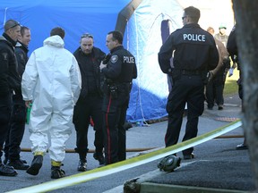 Memmbers of the Ottawa Fire department' hazmat team investigates at the scene of an explosion on Sandcastle Dr. on Monday, Nov. 9, 2015. 
Tony Caldwell/Ottawa Sun