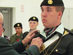 Buster Thiel, of the Petrolia Army Cadet corps,l receives the Major General Howard Award in Petrolia recently. The award ranks Thiel as this year's top cadet in Ontario. Handout/Sarnia Observer/Postmedia Network
Cadet league of Ontario)