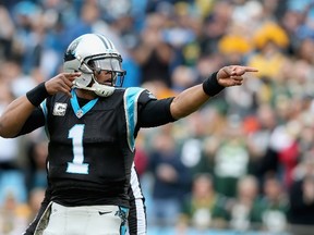 Cam Newton of the Carolina Panthers signals a first down against the Green Bay Packers at Bank of America Stadium on November 8, 2015 in Charlotte, N.C. (Streeter Lecka/Getty Images/AFP)