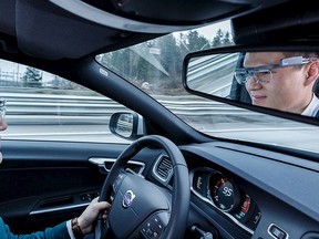 A young man wearing Tobii Pro Glasses 2 drives a car in this undated handout photo supplied by Tobii Oct. 20, 2015. REUTERS/Tobii/Handout