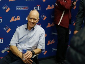 In this Nov. 4, 2015, file photo, New York Mets general manager Sandy Alderson rests in a chair after collapsing during a news conference in New York. (AP Photo/Seth Wenig, File)