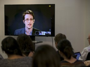American whistleblower Edward Snowden delivers remarks via video link from Moscow to attendees at a discussion regarding an International Treaty on the Right to Privacy, Protection Against Improper Surveillance and Protection of Whistleblowers in Manhattan in September. (REUTERS/Andrew Kelly)
