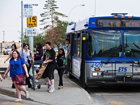 People disembark a bus at Capilano Transit Centre in Edmonton, Alta. on Wednesday, May 27, 2015.