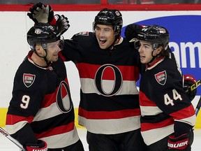 Ottawa Senators' Cody Ceci (5) celebrates his goal wth teammates Jean-Gabriel Pageau (44) and Milan Michalek (9) during first period NHL hockey against the Winnipeg Jets in Ottawa on Thursday, November 5, 2015. Tony Caldwell/ottawa Sun