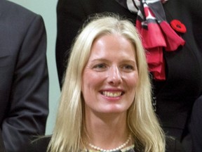 Catherine McKenna, Minister of the Environment Minister and Climate Change, is seen during a group photo after being sworn in Wednesday Nov.4, 2015 in Ottawa. McKenna has green-lighted Montreal's plan to discharge eight billion litres of untreated sewage into the St. Lawrence River if certain conditions are met. THE CANADIAN PRESS/Fred Chartrand