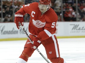 In this March 11, 2011 file photo, Detroit Red Wings defenceman Nicklas Lidstrom, of Sweden, shoots against the Edmonton Oilers in an NHL hockey game in Detroit. Lidstrom was one of seven people inducted into the Hockey Hall of Fame on Nov. 9, 2015. (PAUL SANCYA/AP files)