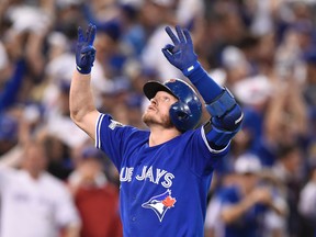 Toronto Blue Jays' Josh Donaldson reacts as he crosses the plate after hitting a two-run home run against the Kansas City Royals during third inning game three American League Championship Series baseball action in Toronto on Monday, Oct. 19, 2015. THE CANADIAN PRESS/Frank Gunn