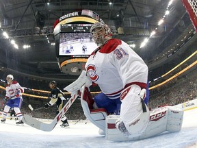 Carey Price #31 of the Montreal Canadiens eyes the puck behind the net during the game against the Pittsburgh Penguins at Consol Energy Center on October 13, 2015 in Pittsburgh, Pennsylvania.   Justin K. Aller/Getty Images/AFP
