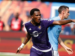 Orlando City SC's Cyle Larin reacts after scoring against New York City FC during the second half of an MLS soccer game at Yankee Stadium, Sunday, July 26, 2015, in New York.  New York defeated Orlando 5-3. (AP Photo/Jason DeCrow)
