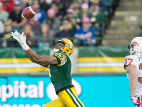 B.C. Lions' Eric Fraser (37), right, chases Edmonton Eskimos' Adarius Bowman (4) as he makes the catch for a touchdown during first half action in Edmonton on Saturday, Oct. 17, 2015. THE CANADIAN PRESS