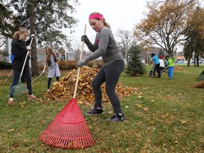 EMILY MOUNTNEY-LESSARD/THE INTELLIGENCER
Students from Susanna Moodie Elementary School work to clean up leaves at the Belleville Cenotaph on Tuesday. The students are members of the school's Earth Care team.
