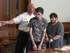 Kevin Norton and James Stumbo leave the courtroom following their dangerousness hearing at Boston Municipal Court, Tuesday, Sept. 1, 2015. (Angela Rowlings/The Boston Herald)