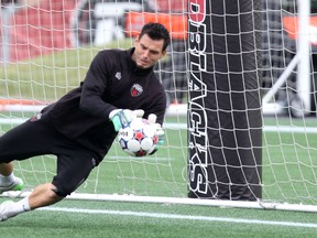 Ottawa Fury FC goalkeeper Romuald Peiser makes a save during training at TD Place on Tuesday, Sept. 29, 2015. (Chris Hofley/Ottawa Sun)