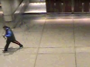 Screengrab from security footage of at Nathan Phillips Square of a man believed to have tied syringes to doors. (Toronto Police handout)