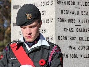 Lincoln and Welland Regiment cadet Noah Huibers stands guard at the newly restored First World War cenotaph at Old Pelham Town Hall during a Remembrance Day service on Sunday, Nov. 8, 2015 in Pelham Ont. Greg Furminger/Welland Tribune/Postmedia Network