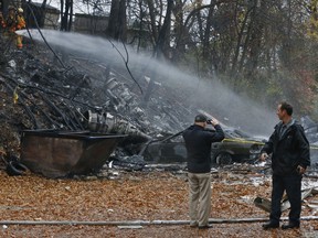 The scene where authorities say a small business jet crashed into an apartment building in Akron, Ohio, Tuesday, Nov. 10, 2015. (Ed Suba Jr./Akron Beacon Journal via AP)