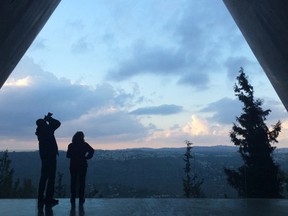 A couple stand outside Yad Vashem looking out at Jerusalem on Tuesday, November 10, 2015. (Don Peat/Toronto Sun)