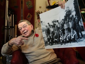 Veteran Jack Ford, 94, talks about his collection of Second World War photos at Sunnybrook Health Sciences Centre on Tuesday, November 10, 2015. (Craig Robertson/Toronto Sun)