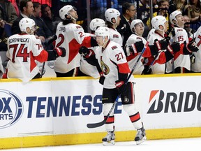 Ottawa Senators right wing Curtis Lazar (27) celebrates with teammates after scoring a goal against the Nashville Predators during the second period of an NHL hockey game Tuesday, Nov. 10, 2015, in Nashville, Tenn. (AP Photo/Mark Humphrey)
