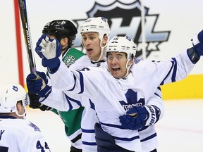 P.A. Parenteau of the Toronto Maple Leafs celebrates his goal with Shawn Matthias in the third period against the Dallas Stars at American Airlines Center in Dallas on Nov. 10, 2015. (Ronald Martinez/Getty Images/AFP)