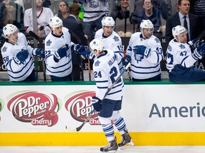 Toronto Maple Leafs centre Peter Holland is congratulated by his teammates after he scored a goal against the Dallas Stars first period at the American Airlines Center in Dallas on Nov. 10, 2015. (Jerome Miron/USA TODAY Sports)