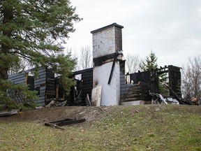 OTTAWA - Nov 12, 2015 - Fire crews continue to investigate a fire on River Rd. near Limebank Rd. that happened Tuesday night. Back in 2013, the same home was raided by cops as they dismantled a marijuana plant grow operation. (DANI-ELLE DUBE/OTTAWA SUN/POSTMEDIA NETWORK)