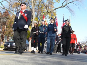 The head of the Sarnia Remembrance Day parade makes its way down Christina Street on Wednesday November 11, 2015 in Sarnia, Ont., on its way to Veterans' Park for a service at the cenotaph. (Paul Morden/Sarnia Observer/Postmedia Network)