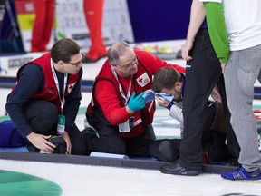 Brad Gushue was defeated by Steve Laycock 5-2 Saturday, Oct. 31, 2015, in quarter-final action at the Grand Slam of Curling Masters in a match that saw Gushue fall and hit his head on the ice in the fourth end. He returned to the ice later in the day with stitches above his right eye. Gushue is seen third from left receiving medical treatment after his fall. Whether a helmet would have protected Gushue when he crashed face-first on the curling ice last week is debatable.But the sight of one of the world's best curlers sporting a swollen right eye and stitches after a fall brings to a boil what was the simmering issue of whether protective headgear should be mandatory in the sport, and at what age. THE CANADIAN PRESS/HO-Anil Mungal
