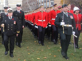The military contingent marches into place at a Remembrance Day ceremony in Kingston on Wednesday. (Michael Lea/The Whig-Standard)