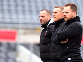 Ottawa Fury FC head coach Marc Dos Santos, right, stands with technical director Phil Dos Santos and assistant coach Martin Nash during training at TD Place on Wednesday, Nov. 11, 2015. (Chris Hofley/Ottawa Sun)