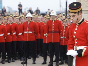 Cadets at the Royal Military College of Canada take their place ahead of the Remembrance Day ceremony in Kingston on Wednesday. (Elliot Ferguson/The Whig-Standard)