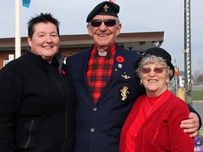 Rev. Don Chisholm, honorary reverend of the Corps of Royal Canadian Electrical and Mechanical Engineers, is seen with his daughter Cheryl Chisholm, left, and wife Helen Chisholm after the Remembrance Day ceremony at Canadian Forces Base Kingston on Wednesday. (Steph Crosier/The Whig-Standard)