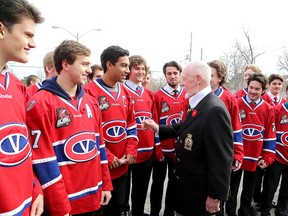 Members of the Kingston Voyageurs meet hockey icon Don Cherry after a Remembrance Day service at the Royal Canadian Legion Branch 560 on Montreal Street on Wednesday. (Ian MacAlpine /The  Whig-Standard)