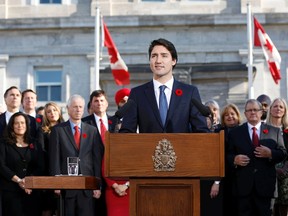 Canada's new Prime Minister Justin Trudeau speaks to the crowd outside Rideau Hall after the government's swearing-in ceremony in Ottawa on November 4, 2015. The transition from one party-led government to another was peaceful and uneventful, as Canadians have come to expect. But that's not always the case in other parts of the world. REUTERS/Blair Gable