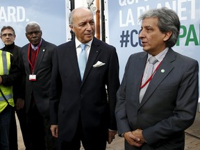 Peru's Minister of Environment Manuel Pulgar Vidal (R) and French Minister of Foreign Affairs Laurent Fabius (L) visit the work site where the forthcoming COP 21 World Climate Summit will be held at Le Bourget, near Paris, France, November 8, 2015. The upcoming conference of the 2015 United Nations Framework Convention on Climate Change (COP 21) will start in Paris on November 30, 2015. REUTERS/Benoit Tessier