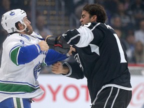 Kings centre Andy Andreoff (right) and Canucks right wing Brandon Prust (left) exchange punches during a game in Los Angeles on Oct. 13, 2015. Andreoff has dropped the gloves a league-leading five times in 14 games this season. (Jayne Kamin-Oncea/USA TODAY Sports)