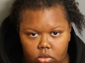 This police mugshot released by the Birmingham, Alabama, Police Department, shows Katerra Lewis, 26, of Birmingham. Lewis has been charged with manslaughter in the death of her daughter one-year-old Kelci Devine Lewis. The toddler was beaten to death on November 10, 2015, by an eight-year-old boy, while Lewis was at a nightclub. AFP PHOTO / Birmingham Police Department