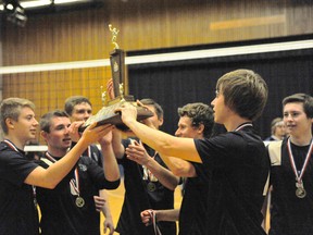 The Delhi Raiders senior boys volleyball team hoist up their newly won NSSAA championship trophy after defeating the Simcoe Sabres 3-1 to claim the crown Wednesday night at Simcoe Composite School. (JACOB ROBINSON Simcoe Reformer)