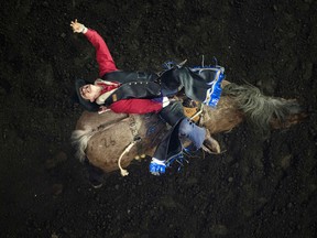 Cole Goodine (Carbon, AB) takes part in the first go round of Bareback Riding during day one of the Canadian Finals Rodeo at Rexall Place, in Edmonton, Alta. on Wednesday Nov. 11, 2015.