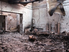 In this Oct. 16, 2015 file photo, the charred remains of the Doctors Without Borders hospital is seen after being hit by a U.S. airstrike in Kunduz, Afghanistan. Immediately after the U.S. killed at least 30 people in a devastating airstrike on a charity hospital, Afghanistan’s national security adviser told a European diplomat that his country would take responsibility. It was convinced the hospital was occupied by Taliban. (Najim Rahim via AP, File)