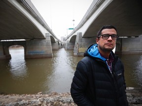 David Alexander Robertson, author of Betty: The Helen Betty Osborne Story, is photographed beside Winnipeg's Red River. (JOHN WOODS/THE CANADIAN PRESS)