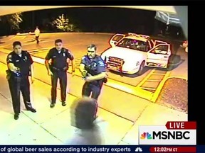Videos obtained by MSNBC show Linwood Lambert Jr., 46, of Richmond, Virginia, repeatedly shocked at the doors of a hospital and then slumping almost unconscious in the back of a police cruiser. (MNSBC/YouTube)