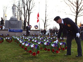A Legion member plants a wreath in the ground at Seaforth’s cenotaph to display honour to the fallen soldiers of war during the Remembrance Day ceremonies.(Shaun Gregory/Huron Expositor)