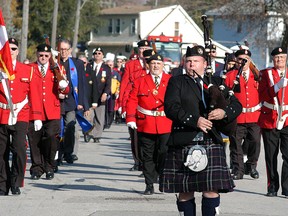 David Gough/Courier Press/david.gough@sunmedia.ca
Members of the Wallaceburg Legion honour guard, led by piper Drew Sydorko, make their way from Wallaceburg District Secondary School to the cenotaph, during Wallaceburg's Remembrance Day ceremonies held on Wednesday, Nov. 11.