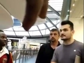 A video posted on Facebook shows Apple store staff telling a  group of black teenagers to leave a store in Melbourne over concerns that they would shoplift. (Francis Ose/Facebook)