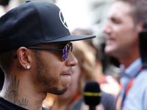 Mercedes driver Lewis Hamilton talks to journalists at the Interlagos race track in Sao Paulo, Brazil, on Thursday, Nov. 12, 2015. The Brazil Grand Prix will take place on Nov. 15. (Andre Penner/AP Photo)