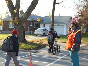 In Seaforth at the Franklin Street and Main Street intersection, Joanne Boyd crosses the students from the Seaforth Public School. It’s been two-decades of cross walking for the Seaforth resident.(Shaun Gregory/Huron Expositor)
