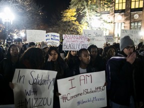 Michigan students stand in solidarity Wednesday, Nov. 11, 2015, with University of Missouri protesters and students, in Ann Arbor, Mich. (Dominic Valente/The Ann Arbor News via AP)
