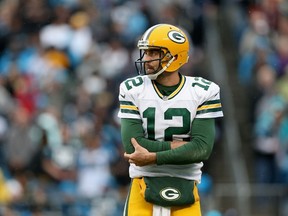 Aaron Rodgers of the Green Bay Packers holds his arm after a play against the Carolina Panthers during their game at Bank of America Stadium in Charlotte on Nov. 8, 2015. (Streeter Lecka/Getty Images/AFP)